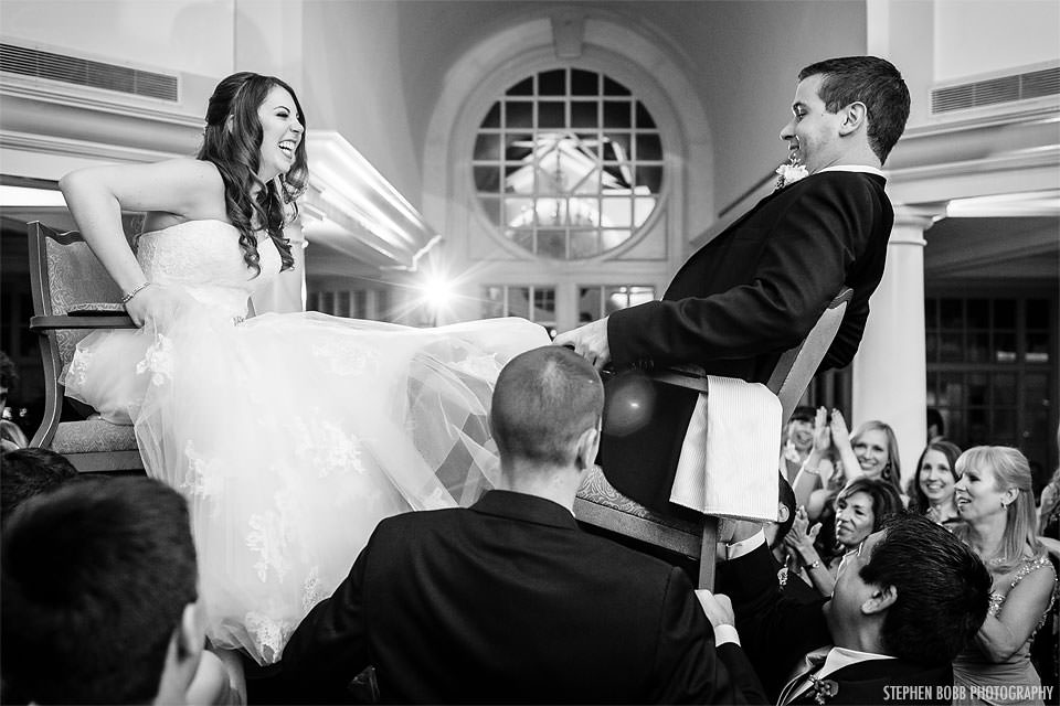 Bride and Groom during a Hora Dance at the Fairmont. Howerton+Wooten Events.